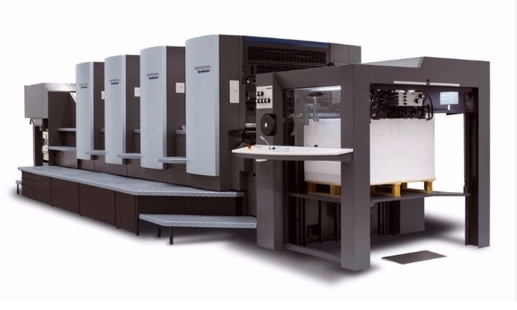 Delivery end of the Heidelberg CD102 press stacking printed sheets