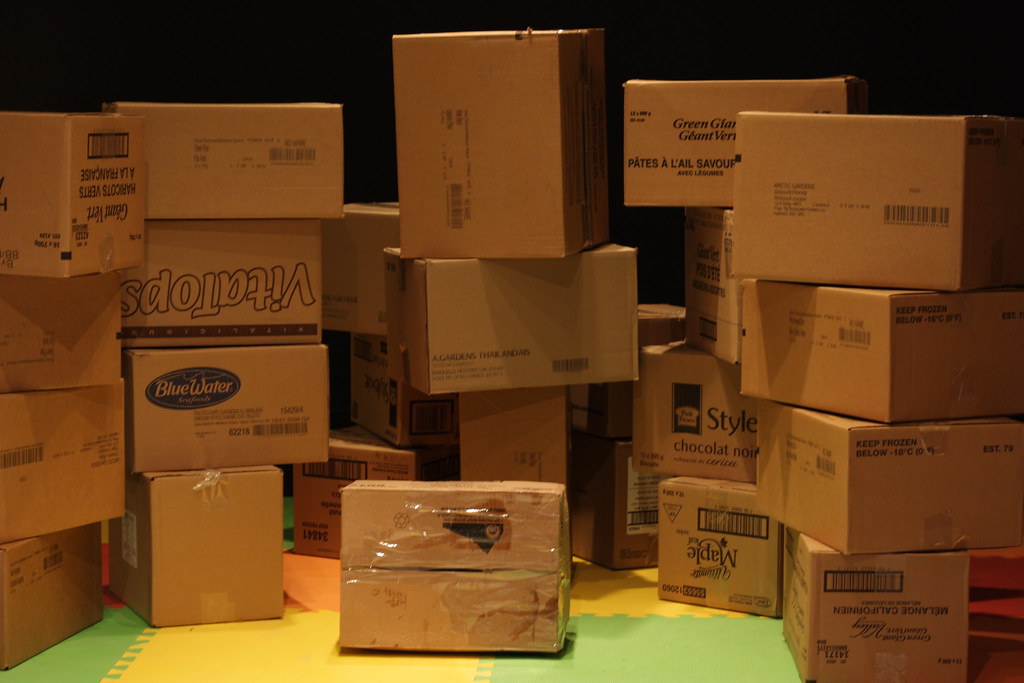 Kraft component boxes with printed part-number panels on a pallet
