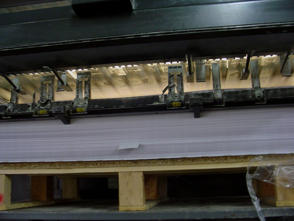 Printed carton sheet on the press with colour control bars visible
